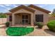 Backyard view of patio, artificial turf, and landscaping at 2074 E Hulet Pl, Chandler, AZ 85225