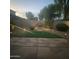 Night view of backyard with lighting and a water feature at 2074 E Hulet Pl, Chandler, AZ 85225