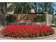 Community entrance features a sign with red flowers at 14950 W Mountain View Blvd # 5311, Surprise, AZ 85374