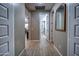 Long hallway with light wood flooring and neutral colored walls at 9624 E Thunderbolt Ave, Mesa, AZ 85212