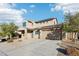 Two story house with driveway and landscaping at 18248 W Foothill Dr, Surprise, AZ 85387