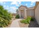 Front entry with walkway, landscaping, and a security door at 11105 W Ashley Chantil Dr, Surprise, AZ 85378