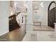 Elegant entryway with a curved staircase and modern design at 9030 N 48Th Pl, Paradise Valley, AZ 85253