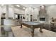 Game room with a pool table, wet bar, and fireplace at 9030 N 48Th Pl, Paradise Valley, AZ 85253