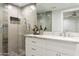 Modern bathroom with walk-in shower and white cabinetry at 9030 N 48Th Pl, Paradise Valley, AZ 85253