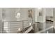 Elegant curved staircase with metal railing and hardwood floors at 9030 N 48Th Pl, Paradise Valley, AZ 85253
