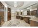 Primary bathroom with a large vanity, granite countertop, and a soaking tub at 9030 N 48Th Pl, Paradise Valley, AZ 85253