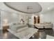 Spacious main bedroom with plush carpet, a chaise lounge, and a large window at 9030 N 48Th Pl, Paradise Valley, AZ 85253
