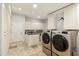 Spacious laundry room with washer, dryer and ample storage at 9030 N 48Th Pl, Paradise Valley, AZ 85253