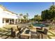 Backyard patio with fire pit and seating area at 9030 N 48Th Pl, Paradise Valley, AZ 85253