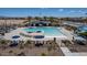 Community pool with lounge chairs and umbrellas at 17632 W Oregon Ave, Litchfield Park, AZ 85340