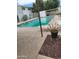 Community swimming pool with lounge chairs and surrounding landscaping at 815 N Hayden Rd # B4, Scottsdale, AZ 85257