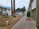 Pathway to community pool with picnic tables and palm trees at 815 N Hayden Rd # B4, Scottsdale, AZ 85257