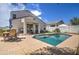 Relaxing backyard with a kidney-shaped pool and patio furniture at 3882 W Alabama Ln, San Tan Valley, AZ 85144