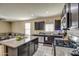 Bright kitchen featuring granite countertops and ample cabinet space at 3882 W Alabama Ln, San Tan Valley, AZ 85144