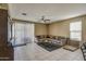 Comfortable living room with tile flooring and sliding glass doors at 3882 W Alabama Ln, San Tan Valley, AZ 85144