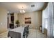 Elegant dining room with a chandelier and four-person table at 3882 W Alabama Ln, San Tan Valley, AZ 85144