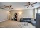 Comfortable living area with sectional sofa and ceiling fan at 3882 W Alabama Ln, San Tan Valley, AZ 85144