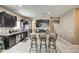 Modern kitchen with granite countertops and dark cabinetry at 3882 W Alabama Ln, San Tan Valley, AZ 85144