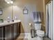 Clean bathroom with dark brown vanity and updated fixtures at 3882 W Alabama Ln, San Tan Valley, AZ 85144