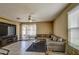 Relaxing living room featuring a large TV and ample seating at 3882 W Alabama Ln, San Tan Valley, AZ 85144