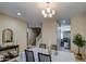 Formal dining room, featuring a chandelier and open view to living area at 3882 W Alabama Ln, San Tan Valley, AZ 85144