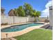Stunning backyard featuring a refreshing pool and lush green grass at 3882 W Alabama Ln, San Tan Valley, AZ 85144