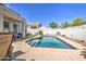 Beautiful backyard with a sparkling pool and a relaxing patio area at 3882 W Alabama Ln, San Tan Valley, AZ 85144
