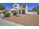Two-story house with a brown garage door and nicely landscaped front yard at 3882 W Alabama Ln, San Tan Valley, AZ 85144