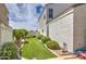 Landscaped backyard with artificial turf and a well-maintained lawn at 3882 W Alabama Ln, San Tan Valley, AZ 85144