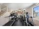 Spacious home gym with various exercise equipment at 3406 E Wildwood Dr, Phoenix, AZ 85048