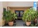 Inviting entryway with double doors and lush landscaping at 3406 E Wildwood Dr, Phoenix, AZ 85048