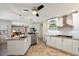 Well-equipped kitchen boasting white cabinets and granite at 3406 E Wildwood Dr, Phoenix, AZ 85048