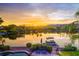 Scenic sunset view of lakefront property with boats at 3406 E Wildwood Dr, Phoenix, AZ 85048