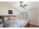 Bright and airy bedroom with wood flooring and lots of natural light at 3406 E Wildwood Dr, Phoenix, AZ 85048