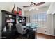 Home office with built-in bookcases and a large desk at 3406 E Wildwood Dr, Phoenix, AZ 85048