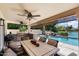 Outdoor patio with lake views, pool, and built-in grill at 3406 E Wildwood Dr, Phoenix, AZ 85048
