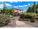 Landscaped backyard with stone pathway leading to the pool at 3406 E Wildwood Dr, Phoenix, AZ 85048