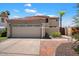 Two-story home with two-car garage and brick pathway at 3406 E Wildwood Dr, Phoenix, AZ 85048