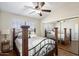 Guest bedroom with mirrored closet doors and wood flooring at 3406 E Wildwood Dr, Phoenix, AZ 85048
