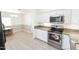 Open kitchen with granite countertops and stainless steel appliances at 8702 E Boise St, Mesa, AZ 85207