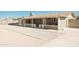 Large backyard with gravel landscaping and covered patio at 8702 E Boise St, Mesa, AZ 85207