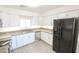 Modern kitchen with stainless steel appliances and granite countertops at 8702 E Boise St, Mesa, AZ 85207