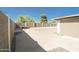 Large backyard with gravel, storage shed, and a paved patio area at 8702 E Boise St, Mesa, AZ 85207