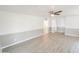 Spacious bedroom with wood-look floors and ceiling fan at 8702 E Boise St, Mesa, AZ 85207