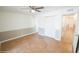 Bright bedroom with ceiling fan, tile floors and access to the backyard at 8702 E Boise St, Mesa, AZ 85207