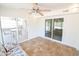 Sunroom with tile floors and access to the backyard patio at 8702 E Boise St, Mesa, AZ 85207