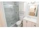 Modern bathroom with a glass shower, updated vanity, and fixtures at 8702 E Boise St, Mesa, AZ 85207