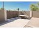 Driveway entrance with modern double wood-look gates at 8702 E Boise St, Mesa, AZ 85207