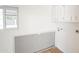Laundry room with cabinets and a large window at 8702 E Boise St, Mesa, AZ 85207